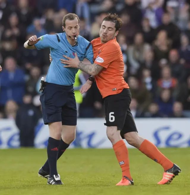 Paul Paton bumps into referee Willie Collum