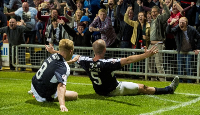 James McPake (right) celebrates his equaliser