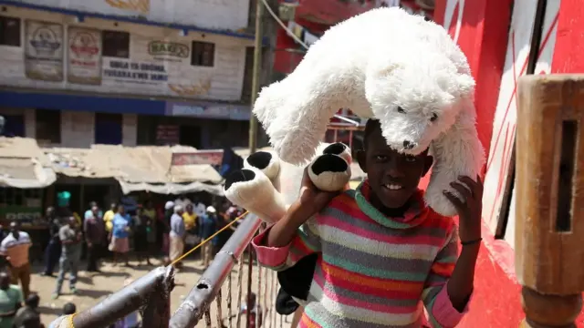 Girl holding a toy polar bear
