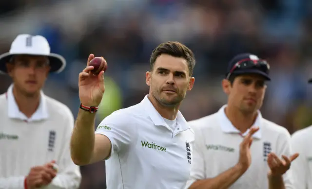 James Anderson raises the ball after taking five wickets