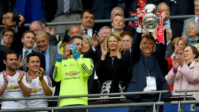 Louis van Gaal lifts the FA Cup trophy