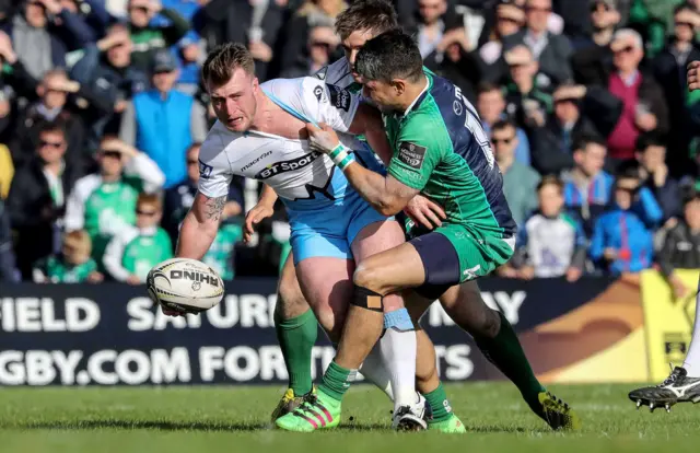 Glasgow's Stuart Hogg is tackled by Niyi Adeolokun