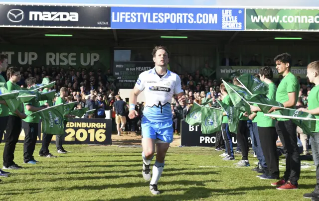 Glasgow centre Peter Horne enters the arena