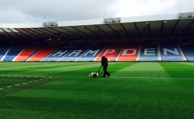 The Hampden pitch is re-lined for the Scottish Cup final