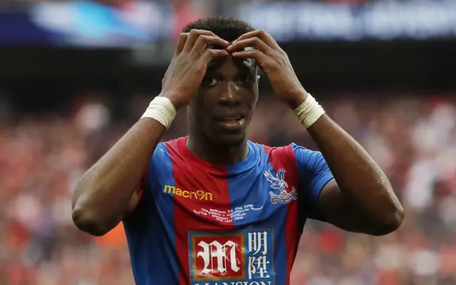 Wilfried Zaha looks dejected