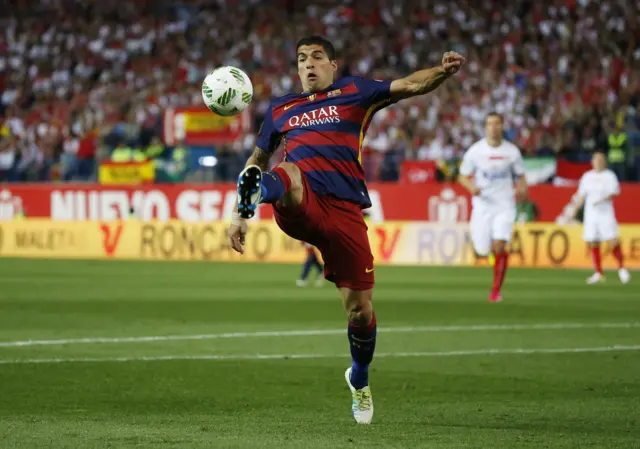 Luis Suarez stretches for the ball