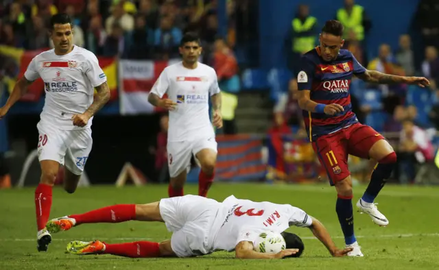 Adil Rami makes a diving tackle on Neymar