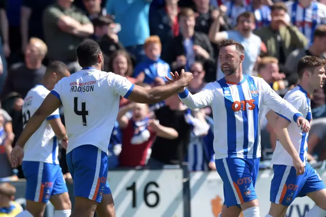 Miles Addison celebrates with Kris Boyd