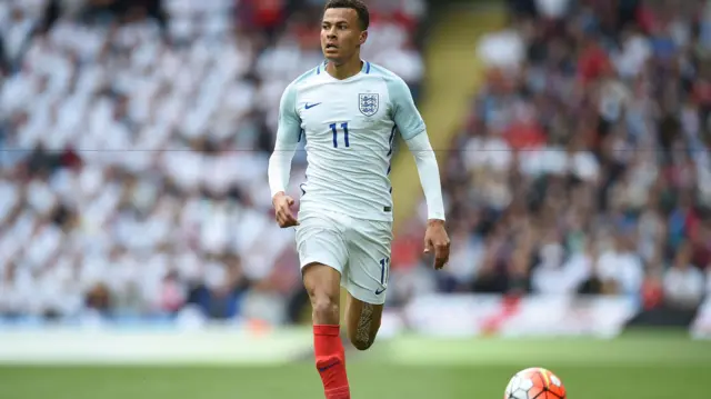 Dele Alli controls the ball