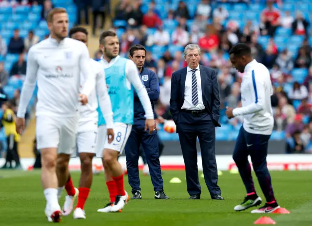 England manager Roy Hodgson looks on as his players warm up