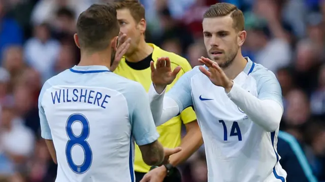 Jack Wilshere comes off for Jordan Henderson