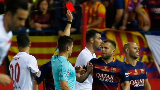 Javier Mascherano is shown a red card