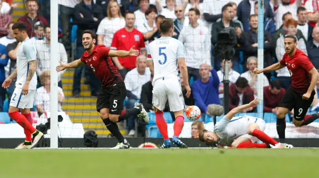 Hakan Calhanoglu celebrates