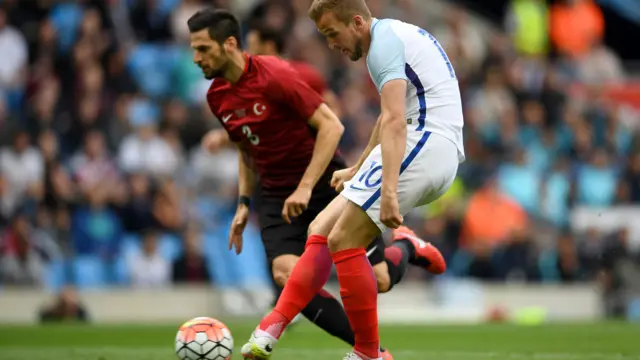 Harry Kane of England scores