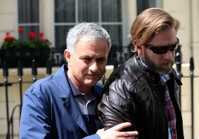 Jose Mourinho and companion