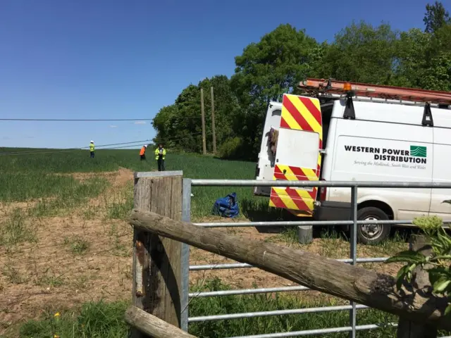 Engineers working on a power line