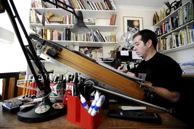 South African political cartoonist Jonathan Shapiro, better known as Zapiro, works at his home on March 15, 2011 in Cape Town.