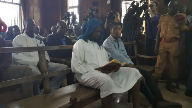 Convicted men waiting in court