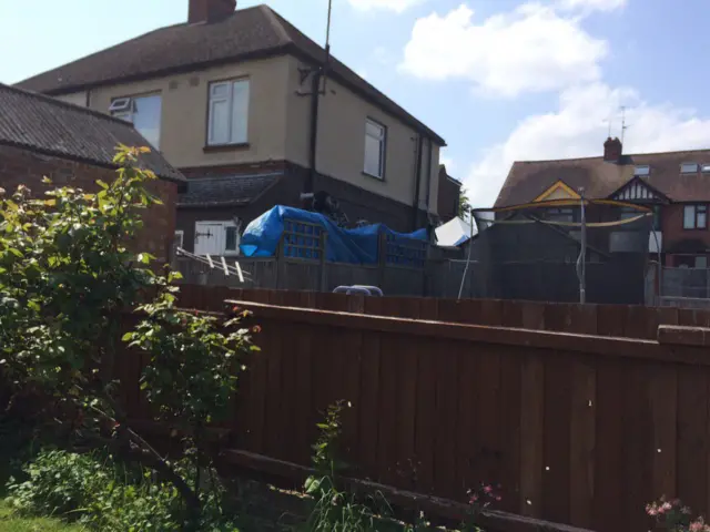 View of murder scene in Overstone road from neighbours garden