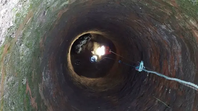 Bobby the cocker spaniel stuck down the well