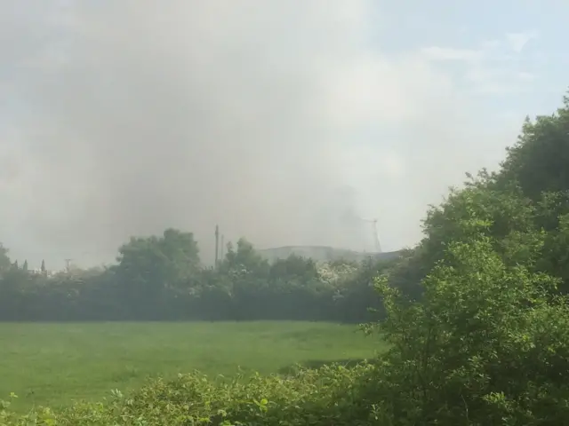 Fire crews dampening down the fire in Clophill