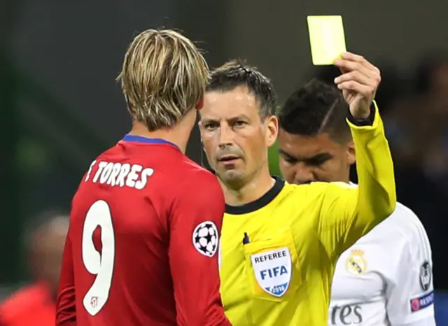 Fernando Torres is shown a yellow card