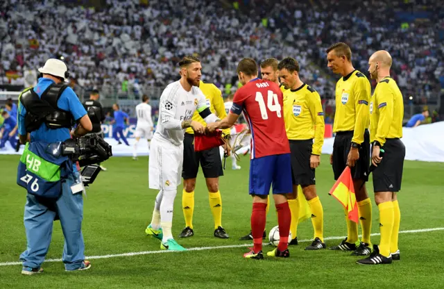 Gabi of Atletico Madrid sahkes the hand to Sergio Ramos