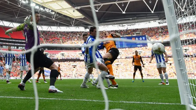 Michael Dawson of Hull City sees a chance go close