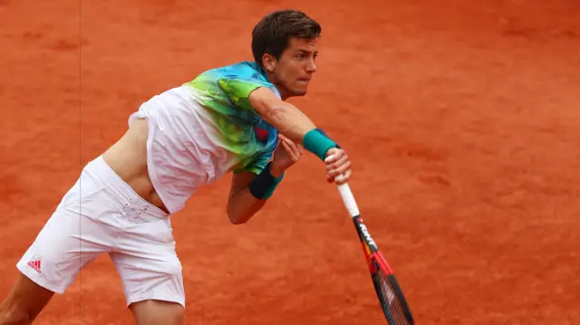 Aljaz Bedene serves