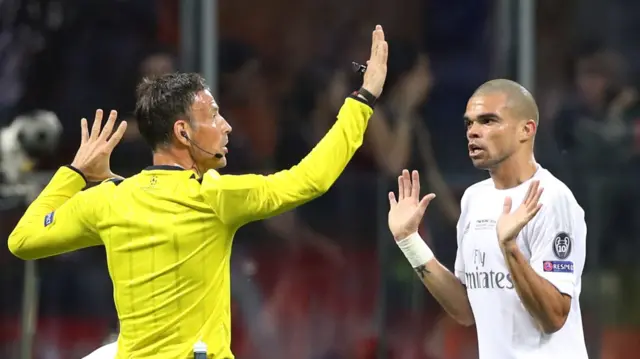 Pepe is spoken to by referee Mark Clattenburg