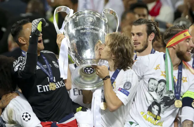 Luka Modric kisses the trophy