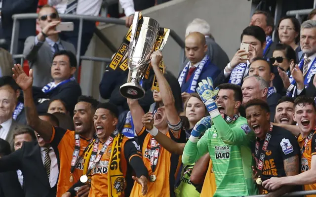 Michael Dawson lifts the trophy