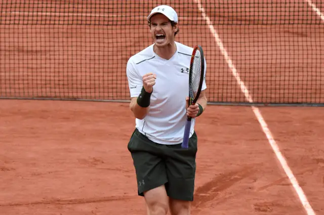 Andy Murray celebrates beating John Isner