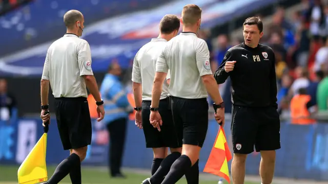 Official leave the pitch at full-time