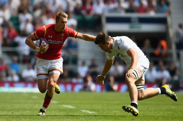 Liam Williams of Wales is tackled by Jack Clifford of England