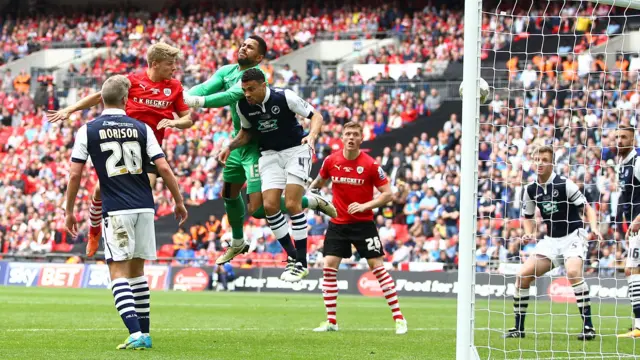 Lloyd Isgrove of Barnsley scores