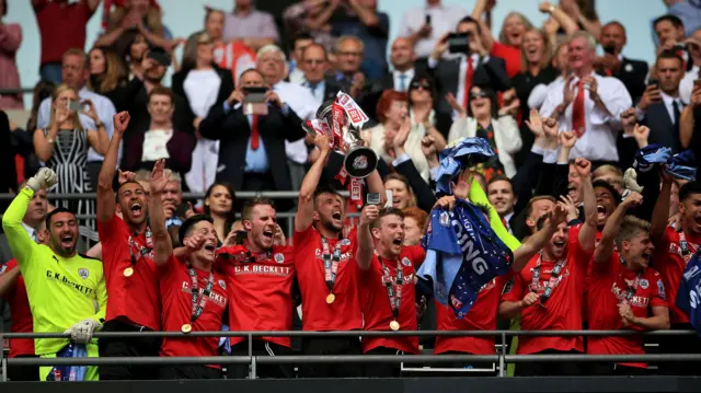 Conor Hourihane lifts the Play-Off trophy