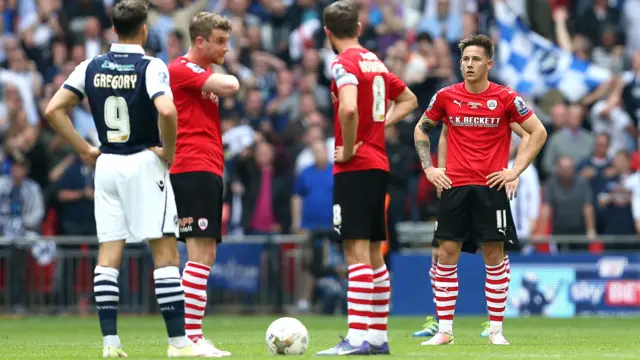 Barnsley players look dejected after conceding