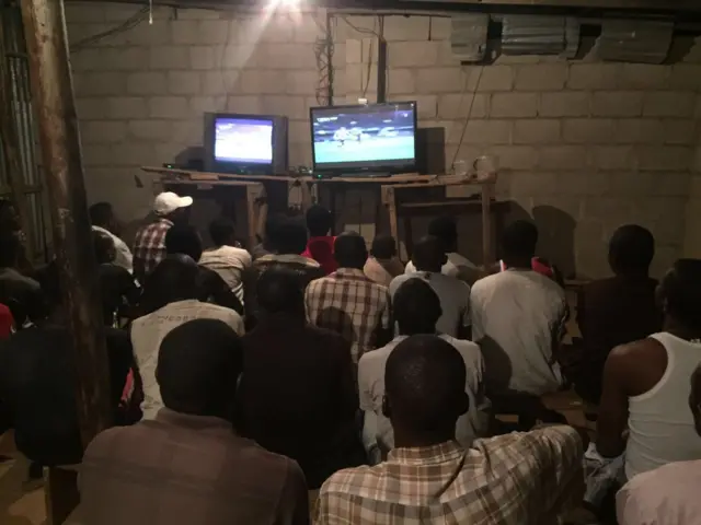 People watching football