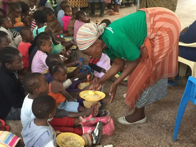 Woman handing out food