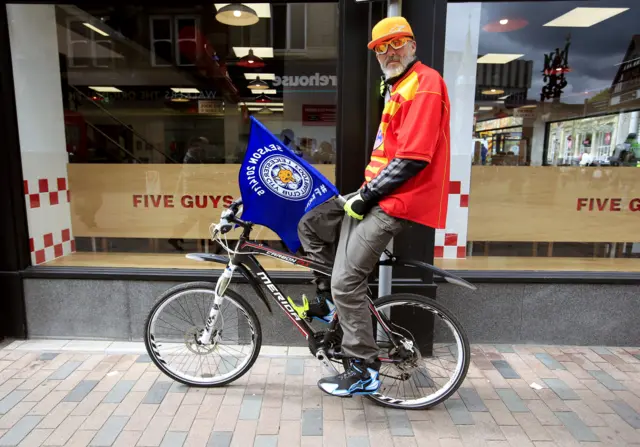 Leicester fan on a bike