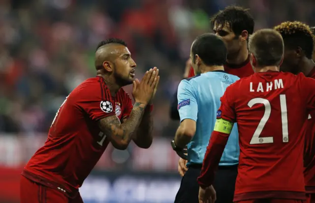 Bayern Munich"s Arturo Vidal reacts after referee Cuneyt Cakir awards a penalty