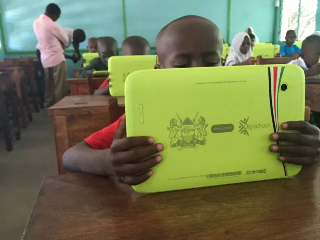 Child with tablet computer
