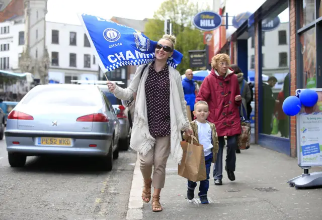 Woman and son with Leicester flag