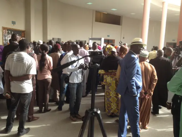 People waiting outside the court