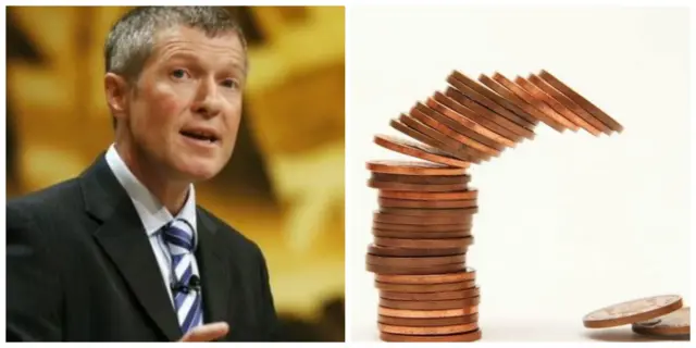 Willie Rennie and tower of pennies