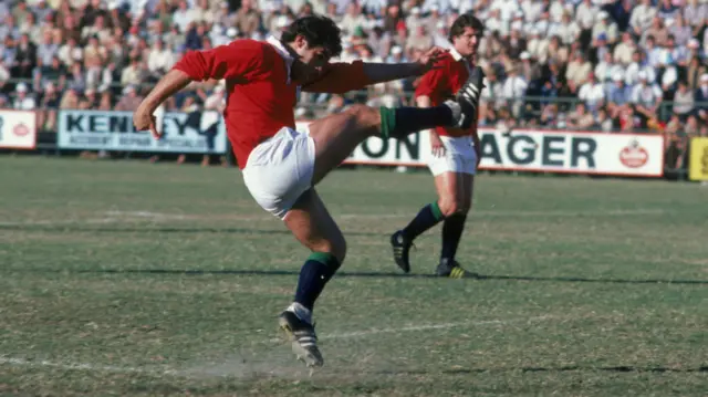 Tony Ward of the Lions kicks at goal