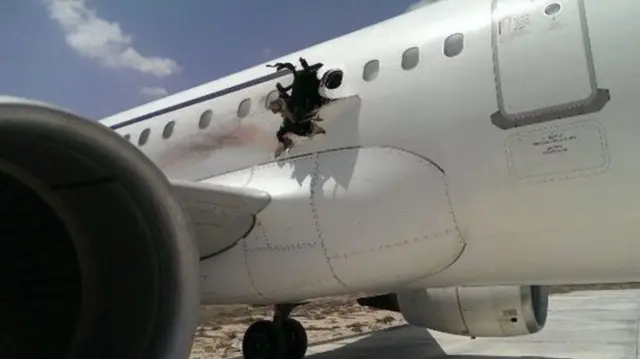 Plane with hole blown in fuselage