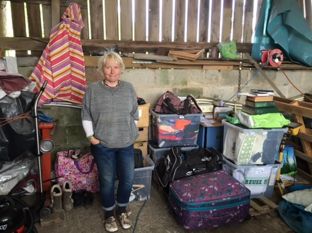 Vanessa Coates with some of the family's remaining possessions at their farm near Ashover
