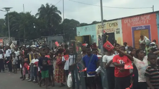 People lining the street in Kinshasa, DR Congo